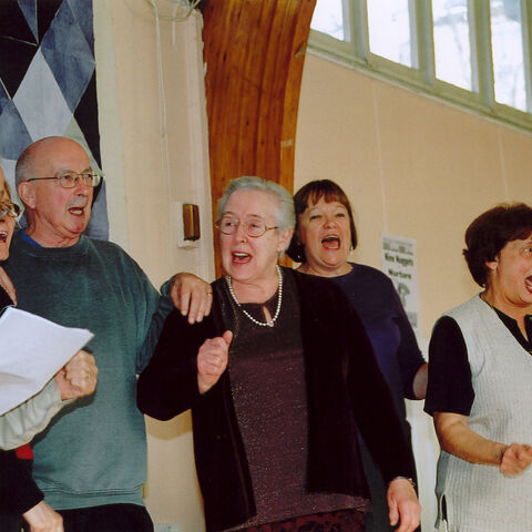 A group photo of HotPots members singing
