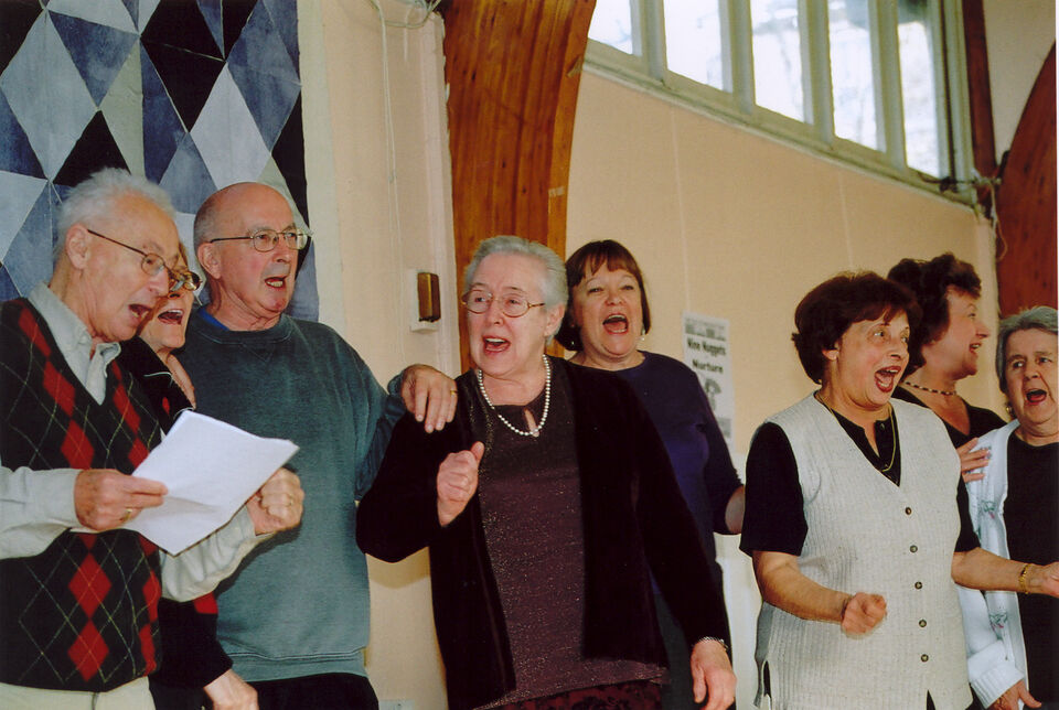 A group photo of HotPots members singing