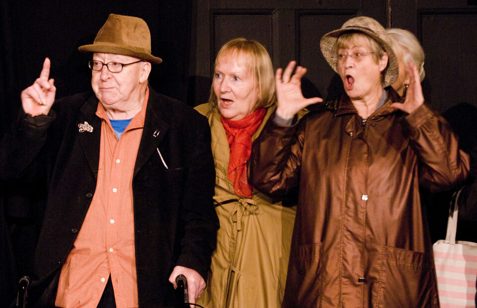 Photo of actors on stage during a performance