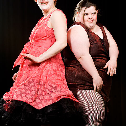 A photo of two actors during a performance of "Dark Inc"