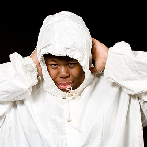 A photo of an actor during a performance of "Dark Inc"