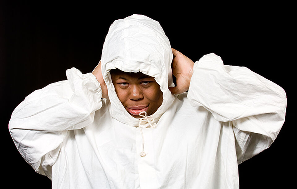 A photo of an actor during a performance of "Dark Inc"