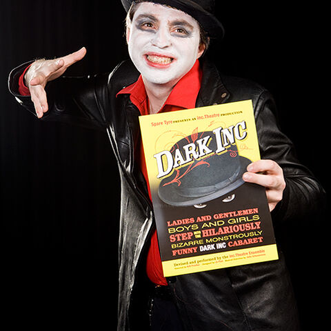 A photo of an actor during a performance of "Dark Inc"