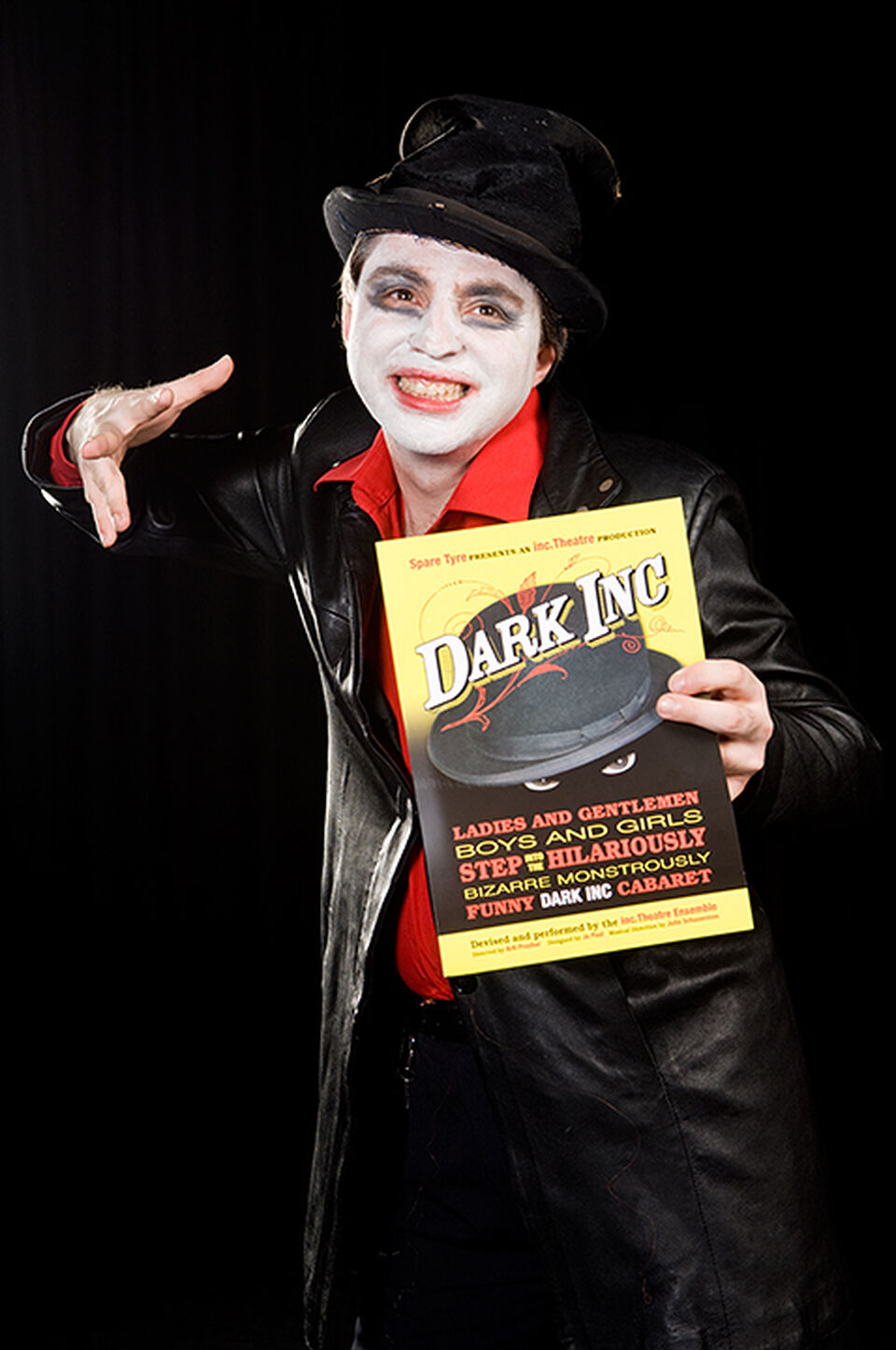 A photo of an actor during a performance of "Dark Inc"