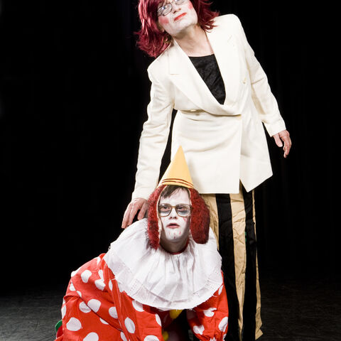 A photo of two actors during a performance of "Dark Inc"