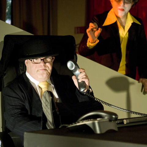 A photo of two actors during a performance of "Dark Inc"