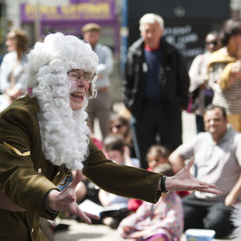 A photo of an actor during a performance of "Trojan Women"