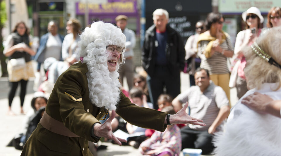 A photo of an actor during a performance of "Trojan Women"