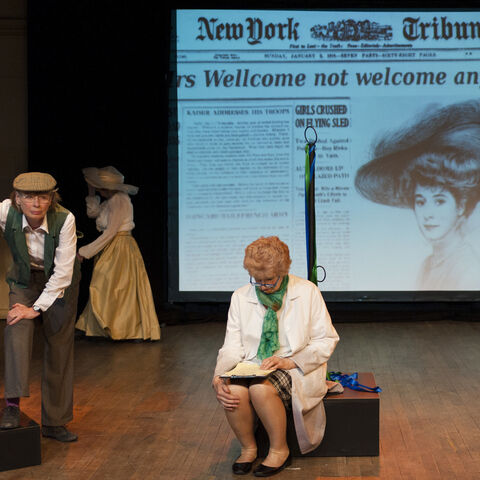 A photo of actors on stage during a performance of "Still Life Dreaming"