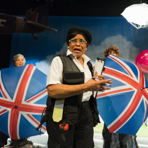 Actors on stage in a production of "SAFE"