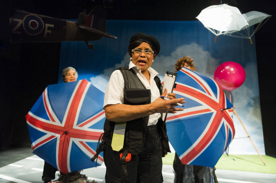 Actors on stage in a production of "SAFE"