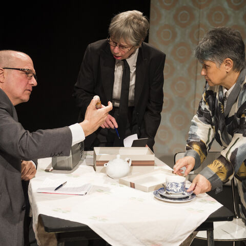 Actors on stage during a performance of "The Promise"