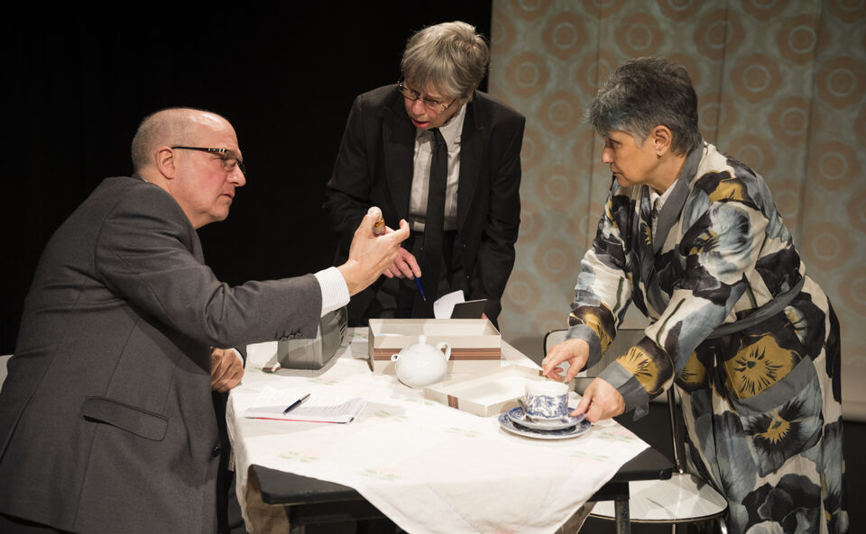 Actors on stage during a performance of "The Promise"