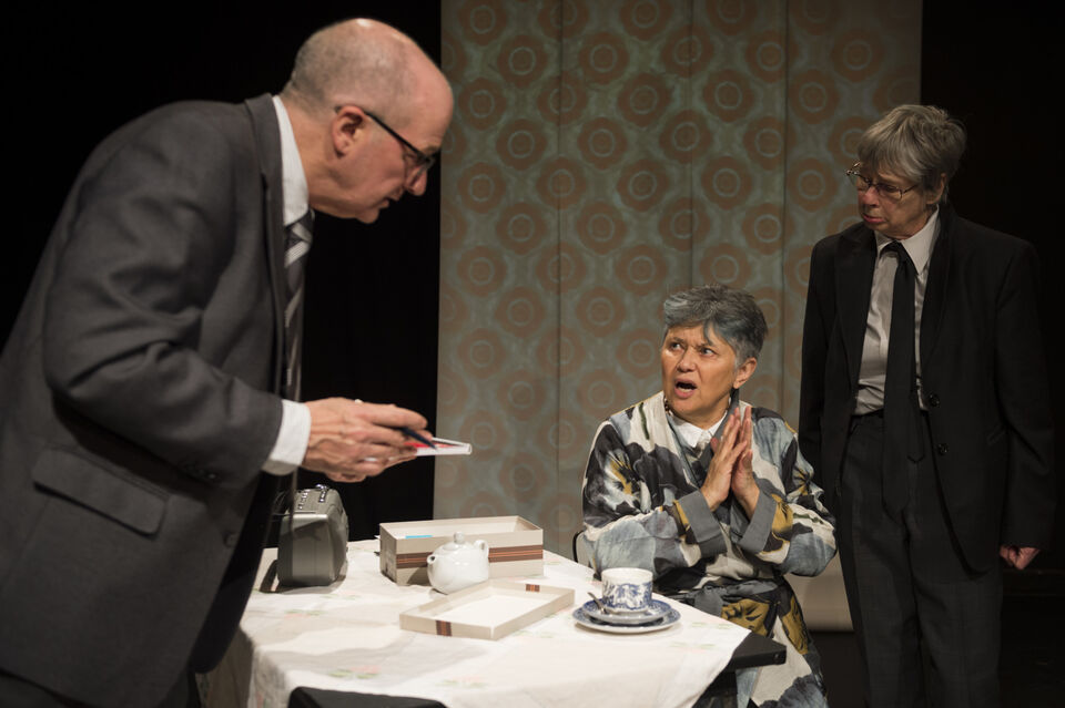 Actors on stage during a performance of "The Promise"