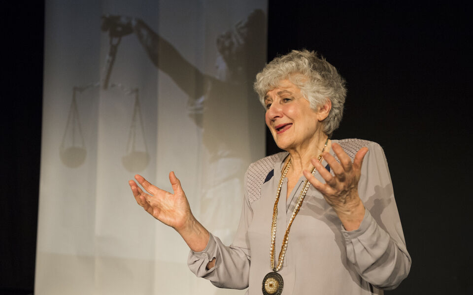 An actor on stage during a performance of "The Promise"