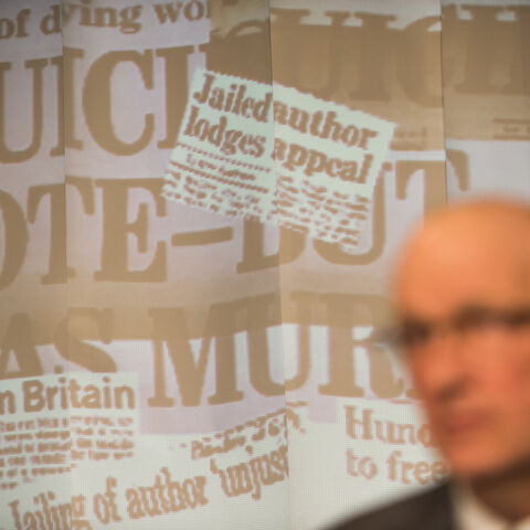 An actor on stage during a performance of "The Promise"