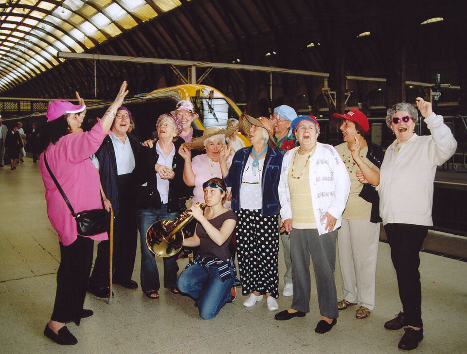 Group photo of members of SCAT at a train station
