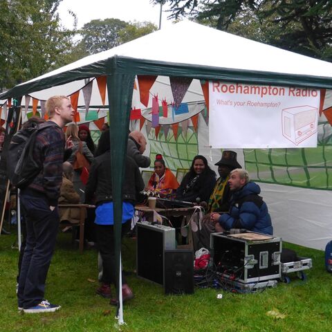 Spare Tyre participants at a stall for the radio project