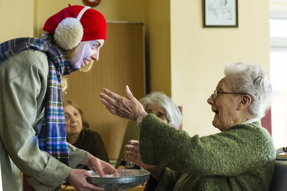 Photo of actor with audience member during 'The Garden' performance